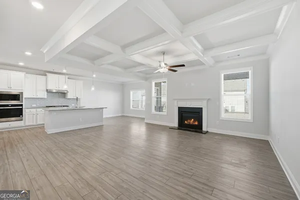 a view of kitchen with cabinets and wooden floor