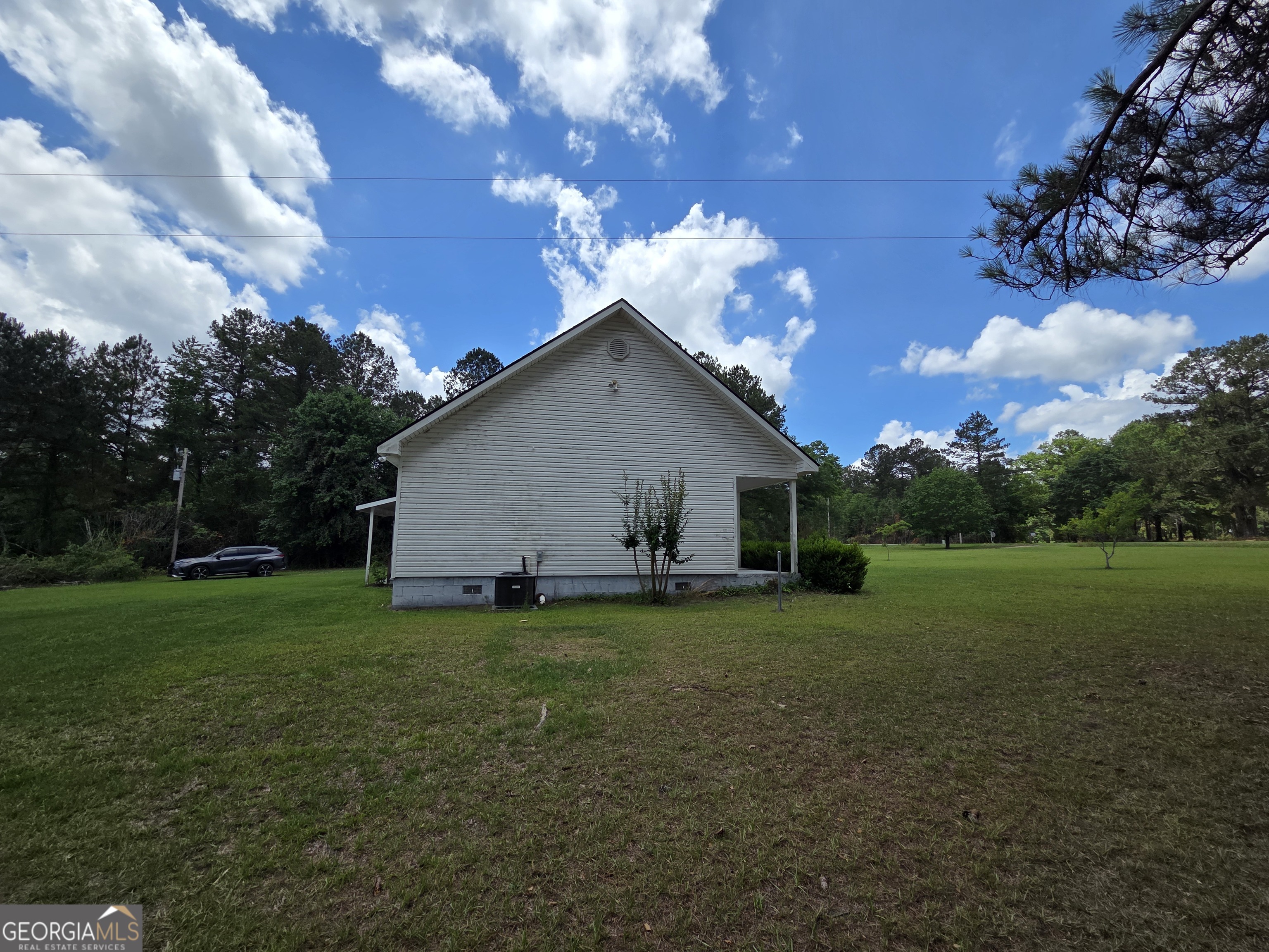 9546 Union Road Metter, GA 30439 - Photo 39 of 45 a view of a house with a yard