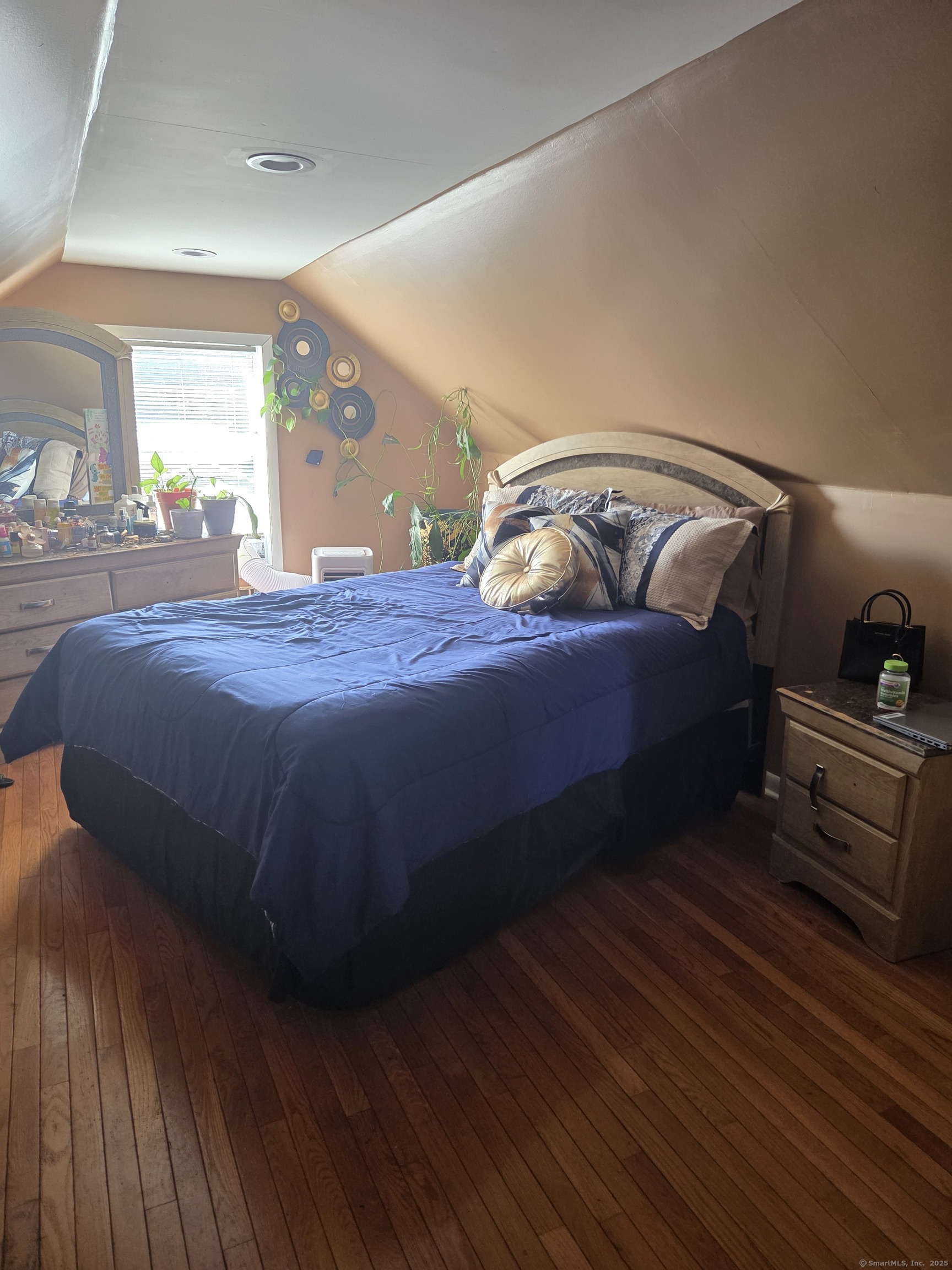 424 Circular Avenue Hamden, CT 06514 - Photo 11 of 14 a bedroom with a bed and window