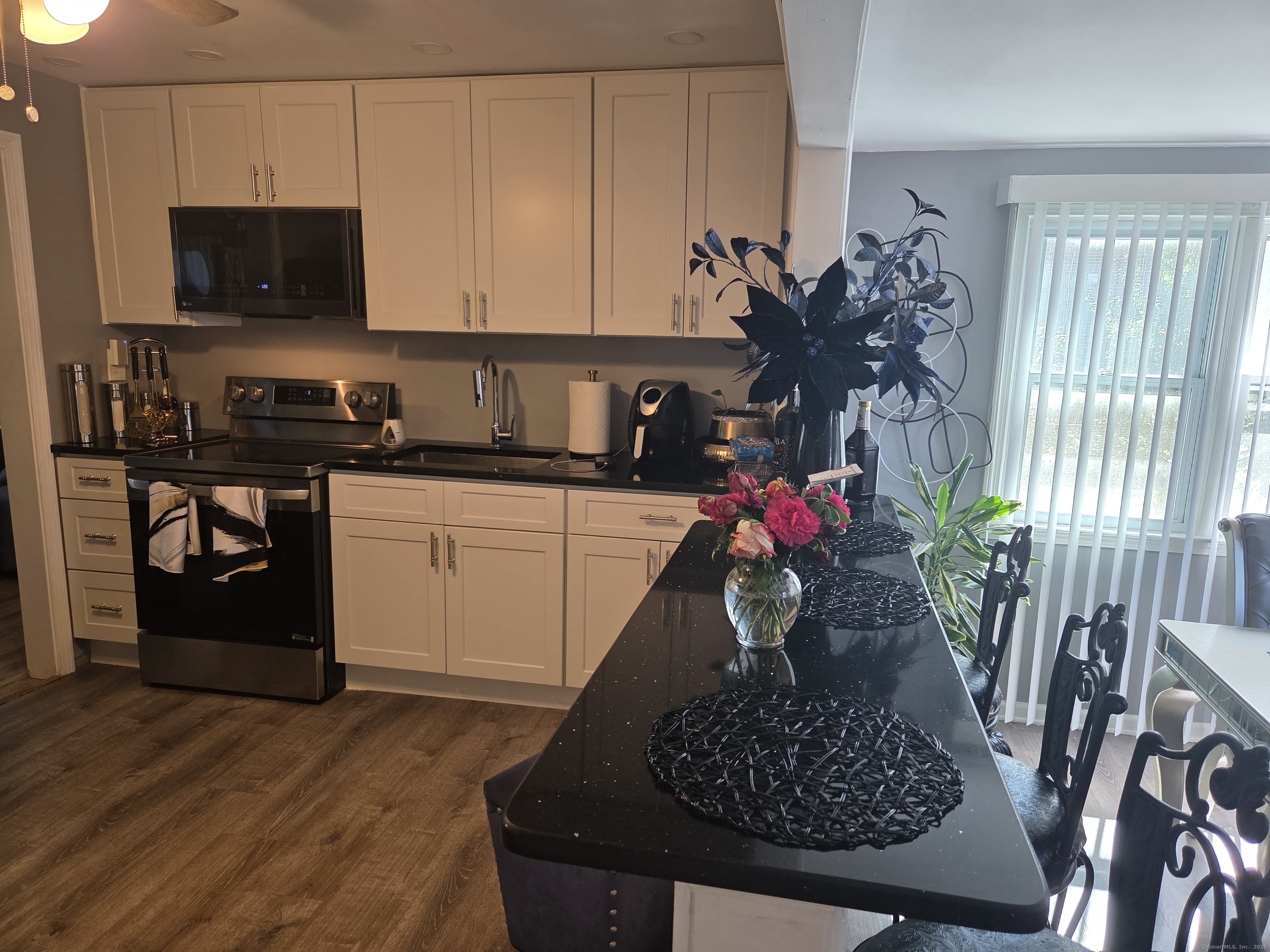 424 Circular Avenue Hamden, CT 06514 - Photo 3 of 14 a kitchen with a sink appliances and cabinets