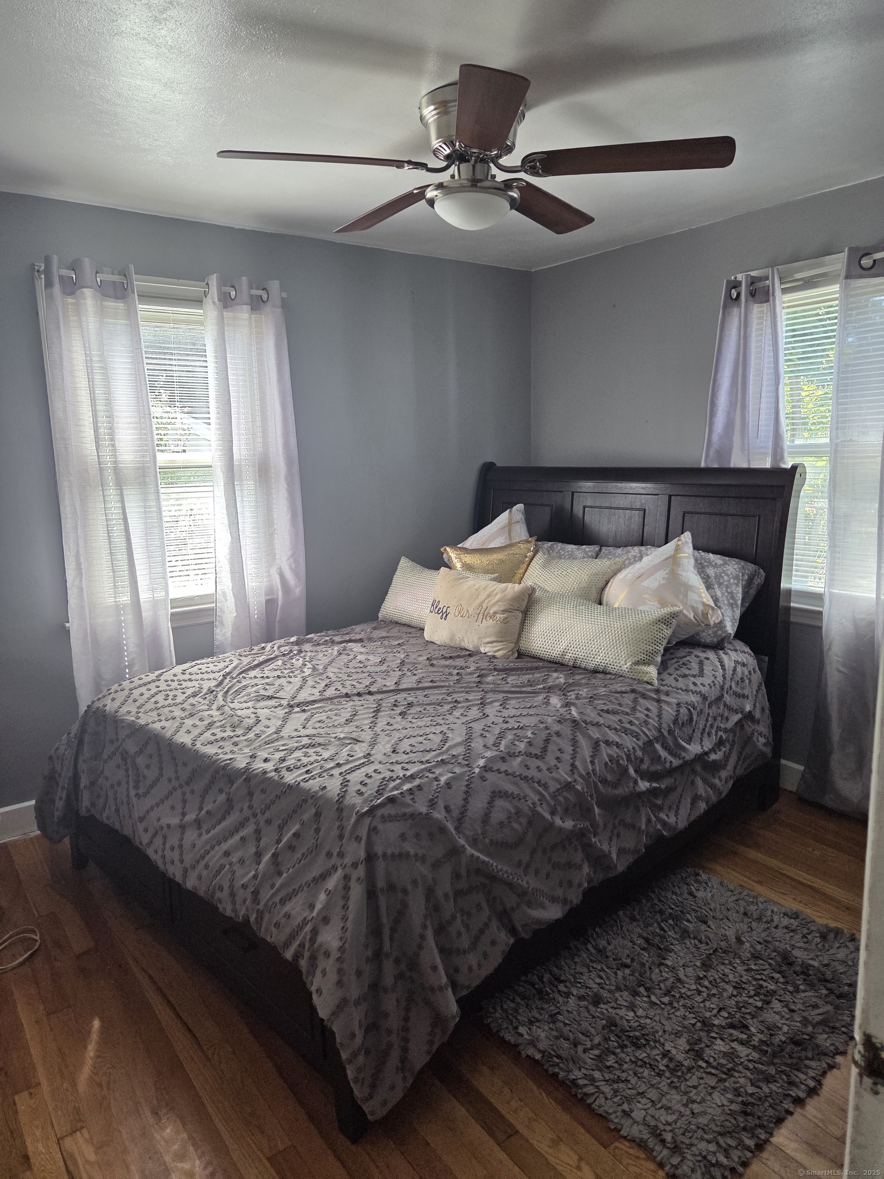 424 Circular Avenue Hamden, CT 06514 - Photo 5 of 14 a bedroom with a bed rug and window