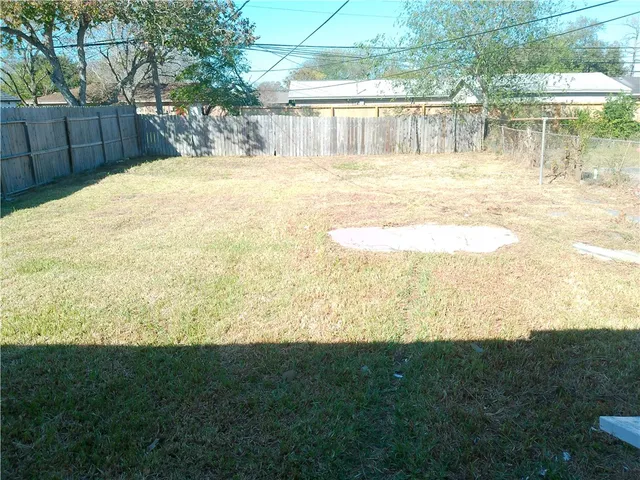 a view of a yard with an outdoor space