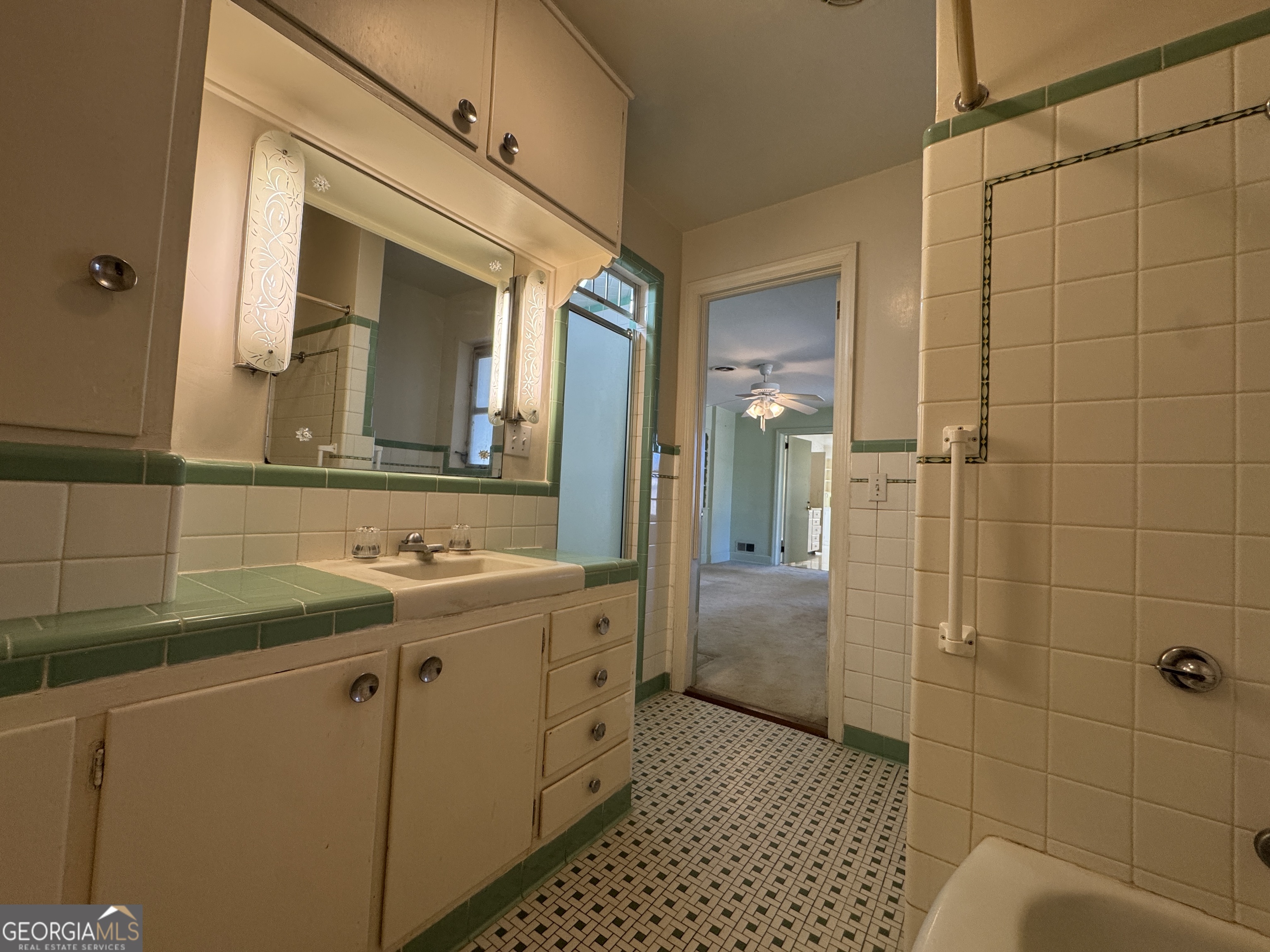 465 Cedar Street Metter, GA 30439 - Photo 16 of 47 a bathroom with a sink a toilet and shower