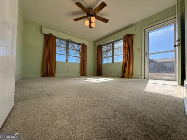 a view of an empty room with a window
