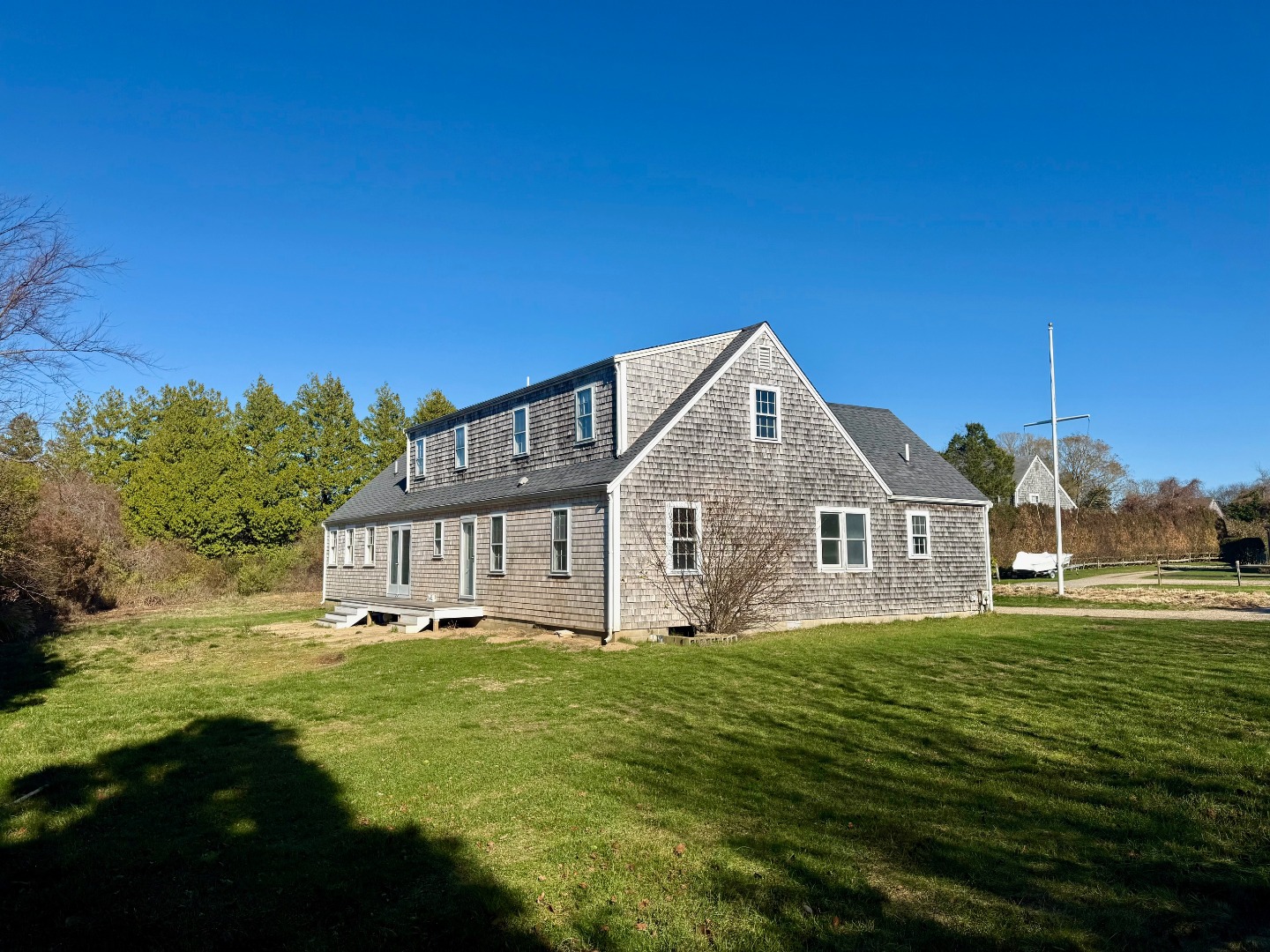 1 Pinkham Circle Nantucket, MA 02554 - Photo 11 of 12 a front view of a house with garden