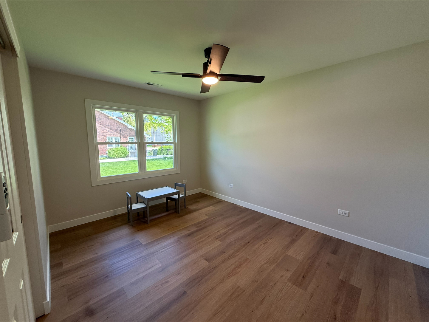 289 Chestnut Street Antioch, IL 60002 - Photo 11 of 24 wooden floor in an empty room with a window