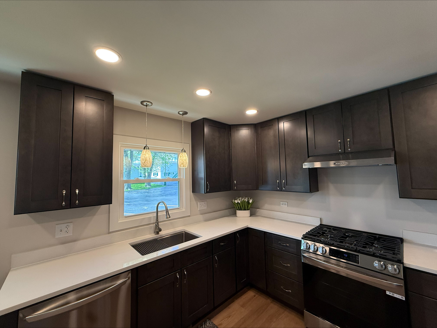 289 Chestnut Street Antioch, IL 60002 - Photo 16 of 24 a kitchen with kitchen island granite countertop a sink stainless steel appliances and cabinets