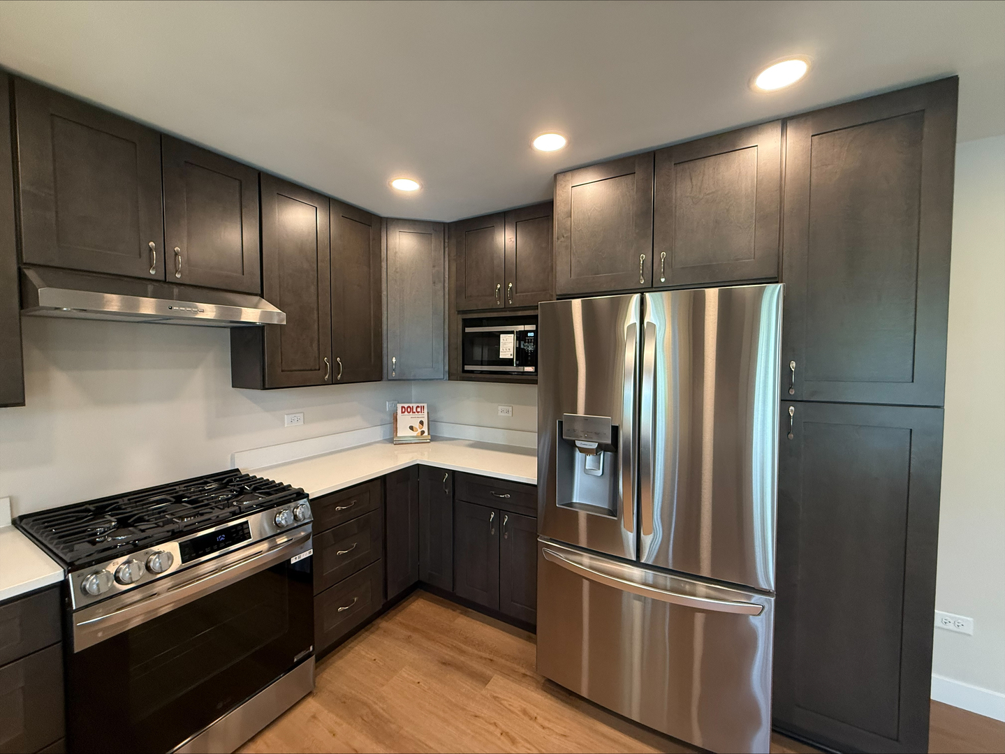 289 Chestnut Street Antioch, IL 60002 - Photo 17 of 24 a kitchen with stainless steel appliances wooden cabinets and stove