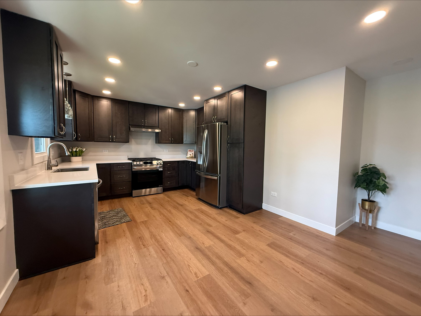 289 Chestnut Street Antioch, IL 60002 - Photo 19 of 24 a large kitchen with stainless steel appliances kitchen island a large counter top a stove a refrigerator and a sink