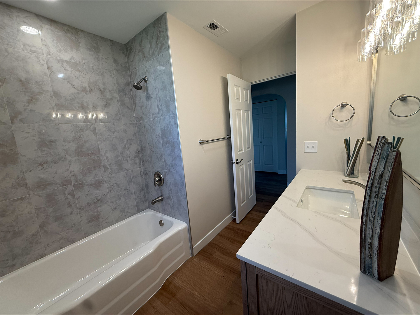 289 Chestnut Street Antioch, IL 60002 - Photo 9 of 24 a bathroom with a tub sink and mirror