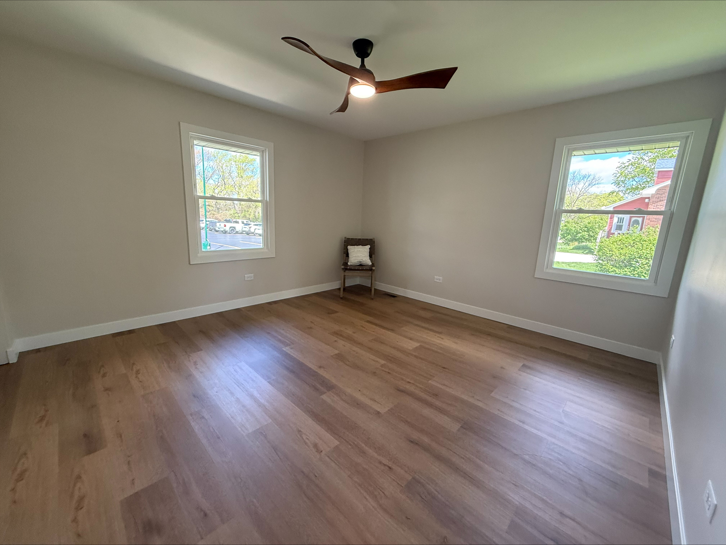 289 Chestnut Street Antioch, IL 60002 - Photo 10 of 24 a view of an empty room with wooden floor and a window