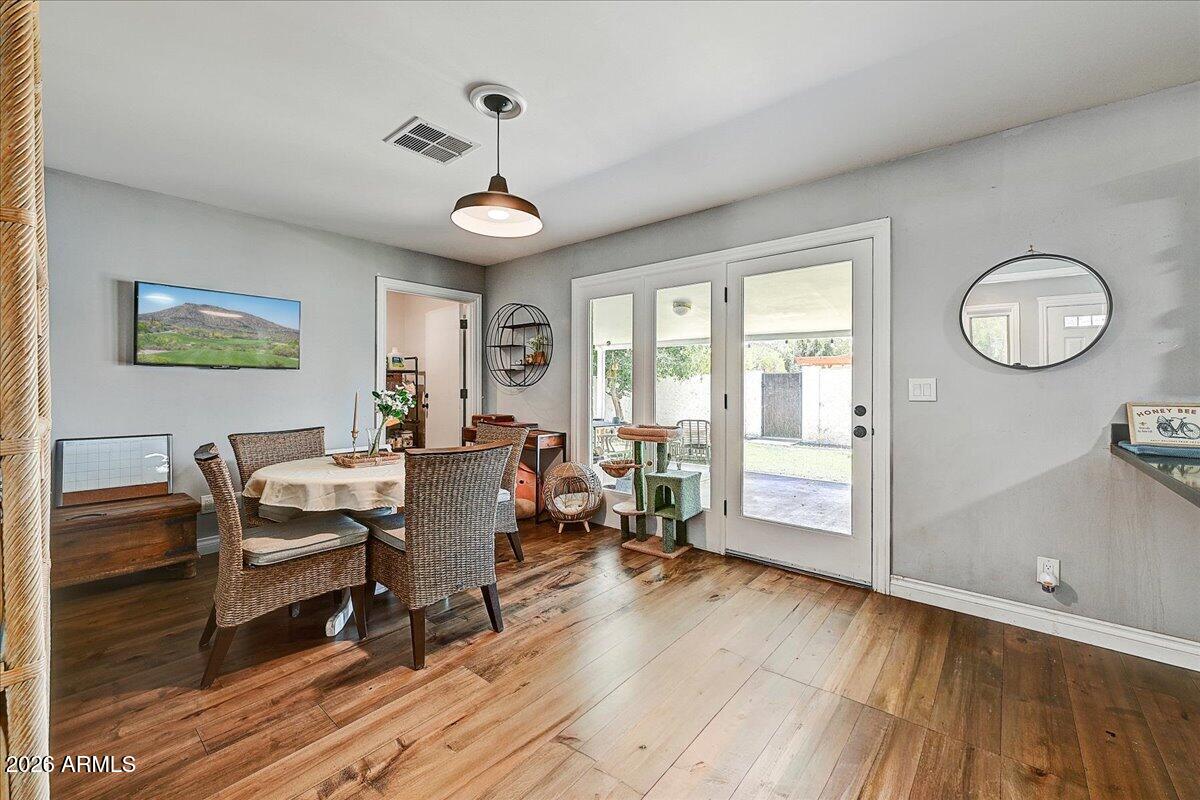 607 West 15th Street Tempe, AZ 85281 - Photo 9 of 29 a living room with furniture a large window and wooden floor
