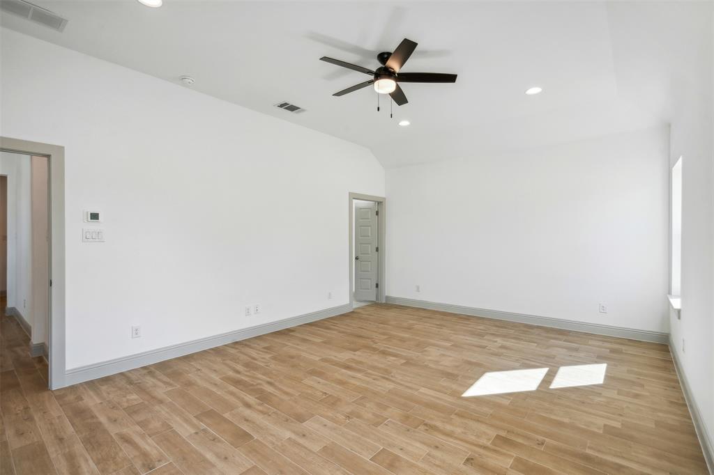 191 Lucky Ridge Lane Boyd, TX 76023 - Photo 16 of 38 a view of room with a ceiling fan and wooden floor