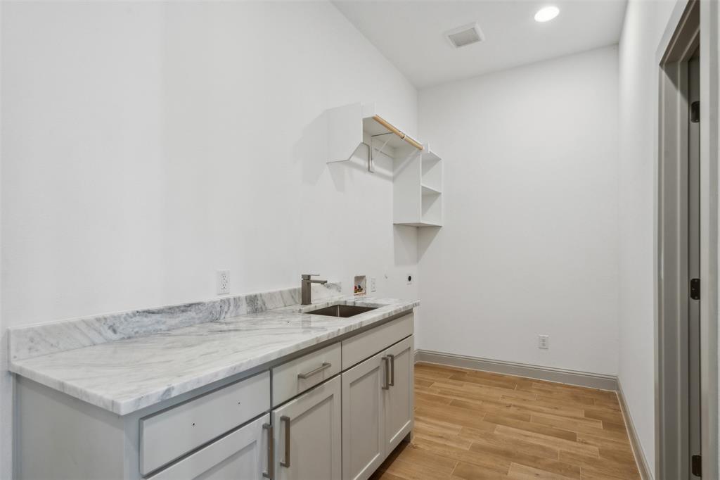 191 Lucky Ridge Lane Boyd, TX 76023 - Photo 21 of 38 a bathroom with a granite countertop sink and a mirror