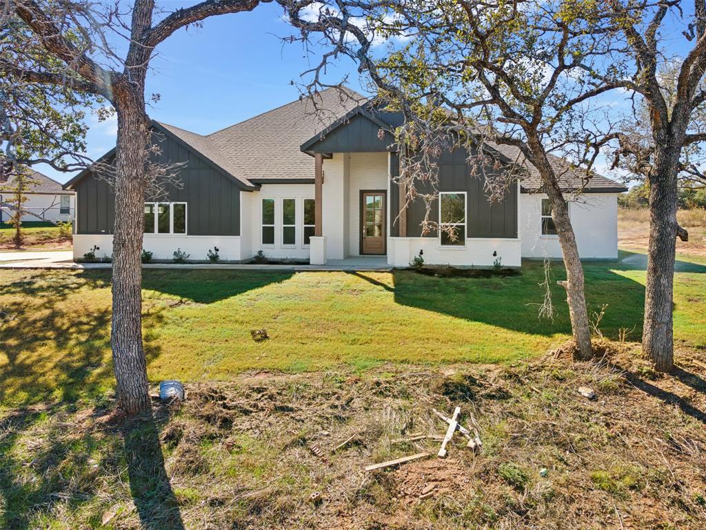 191 Lucky Ridge Lane Boyd, TX 76023 - Photo 30 of 38 a view of a house with backyard porch and sitting area
