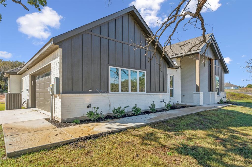 191 Lucky Ridge Lane Boyd, TX 76023 - Photo 3 of 38 a view of a house with a small yard