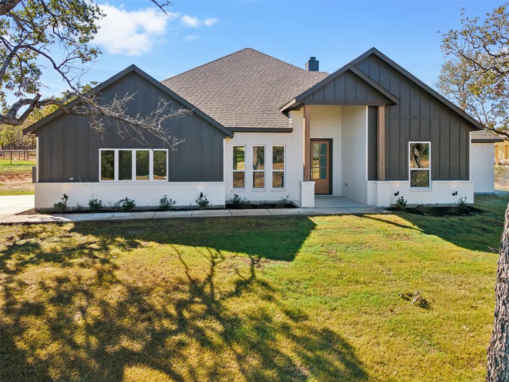 191 Lucky Ridge Lane Boyd, TX 76023 - Photo 31 of 38 a front view of a house with swimming pool