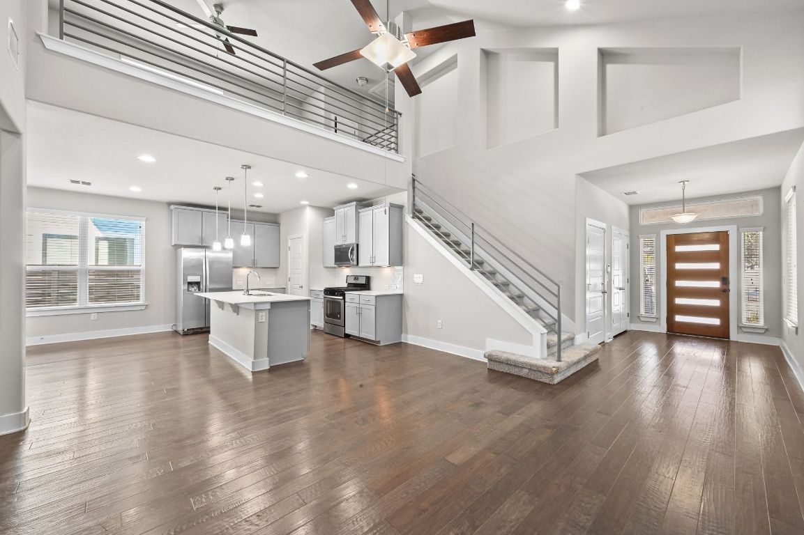 2108 Hermia Street Austin, TX 78741 - Photo 11 of 28 a view of kitchen and hall with wooden floor