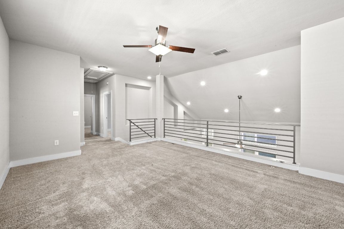 2108 Hermia Street Austin, TX 78741 - Photo 18 of 28 an empty room with a ceiling fan and window