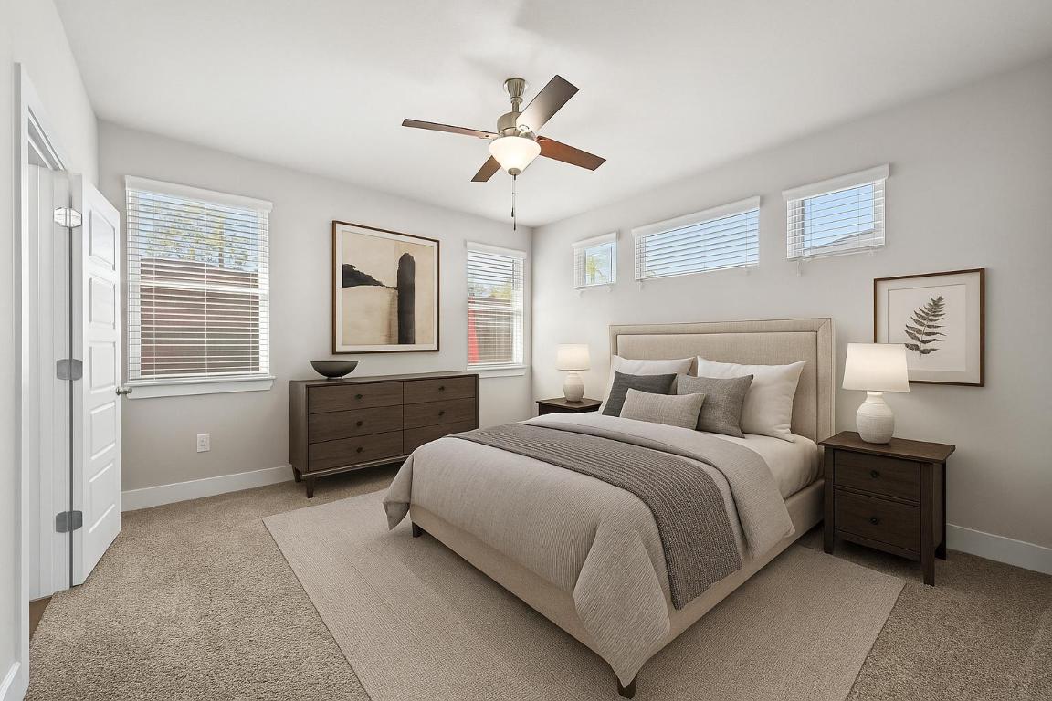 2108 Hermia Street Austin, TX 78741 - Photo 2 of 28 a bedroom with a bed and a chandelier