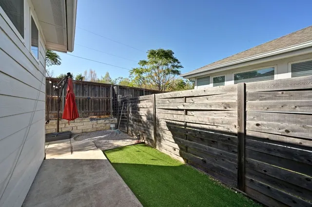 a view of outdoor space with seating area and trees around