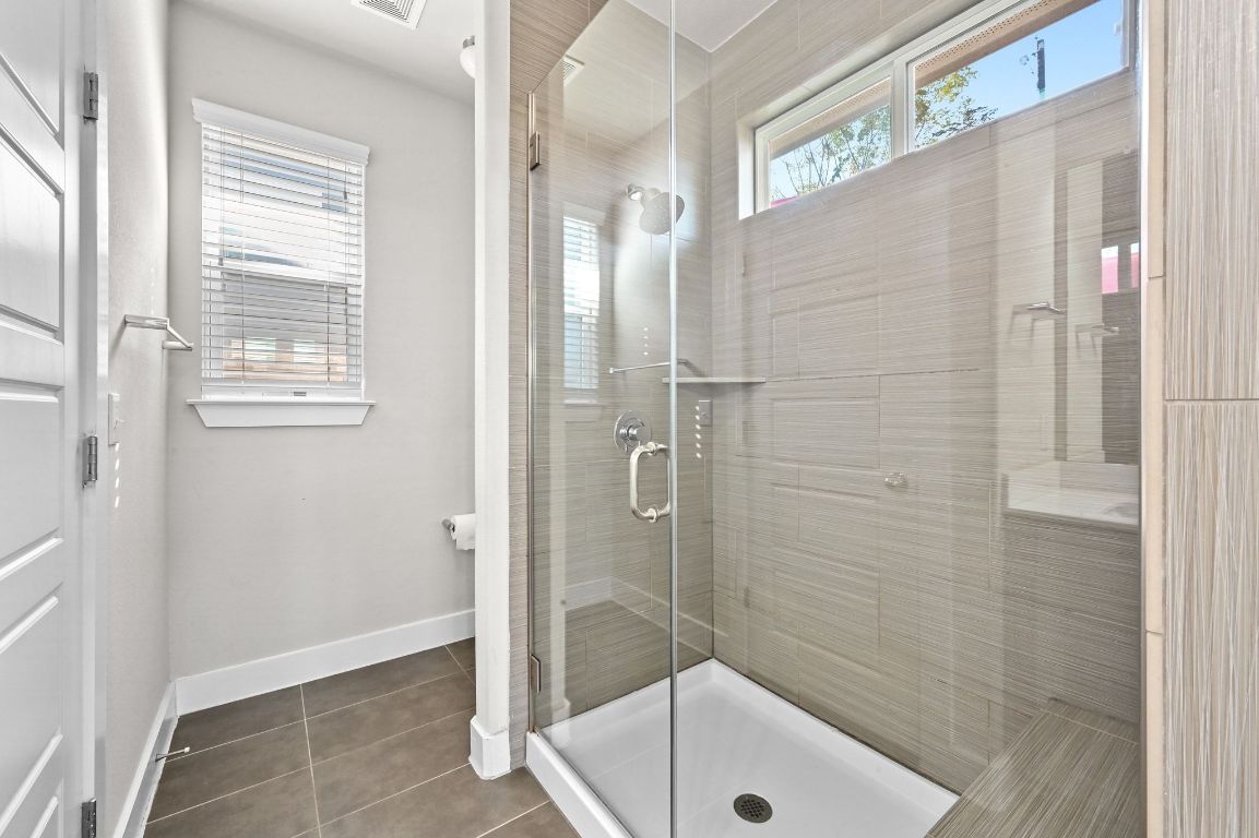 2108 Hermia Street Austin, TX 78741 - Photo 7 of 28 a bathroom with a shower