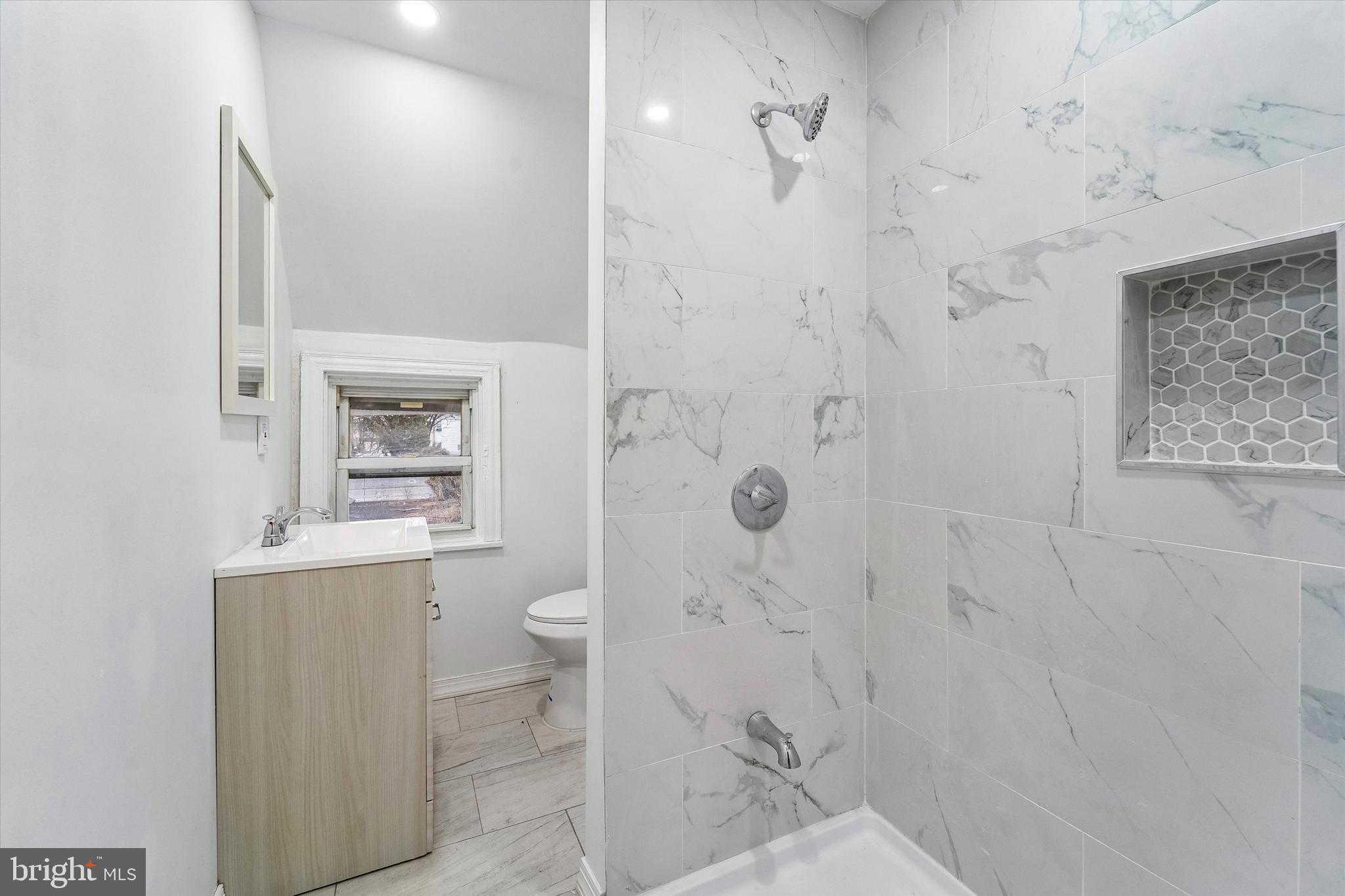 79 High Street, Unit 2 Philadelphia, PA 19144 - Photo 11 of 17 a bathroom with a shower toilet and sink