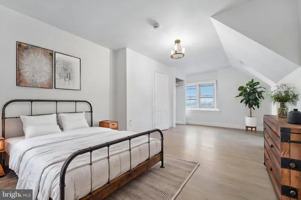 a bedroom with bed and window