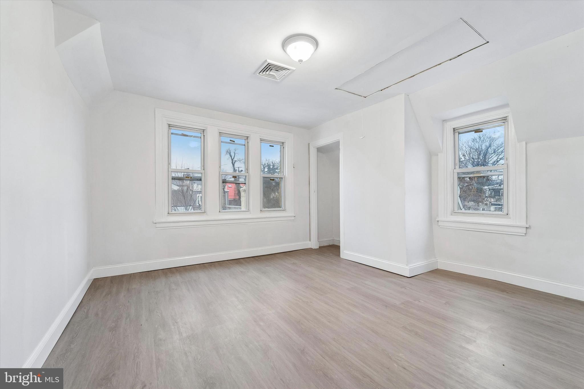 79 High Street, Unit 2 Philadelphia, PA 19144 - Photo 16 of 17 an empty room with wooden floor and windows