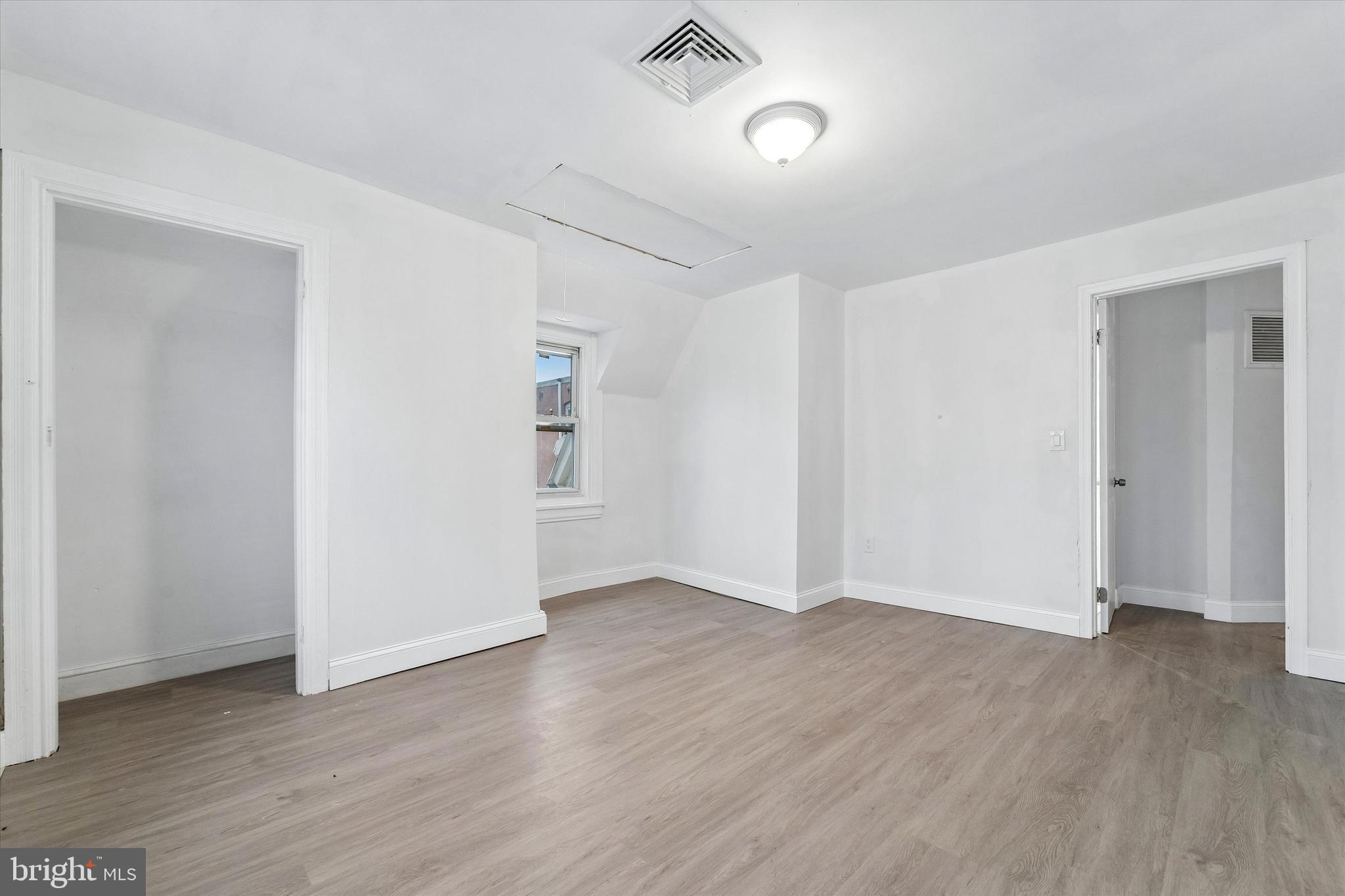 79 High Street, Unit 2 Philadelphia, PA 19144 - Photo 2 of 17 an empty room with wooden floor and windows