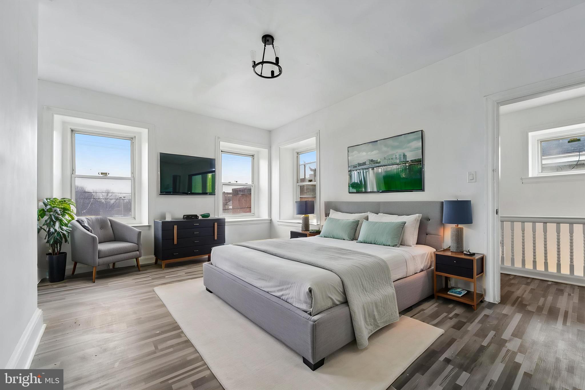 79 High Street, Unit 2 Philadelphia, PA 19144 - Photo 6 of 17 a bedroom with a large bed couch and windows