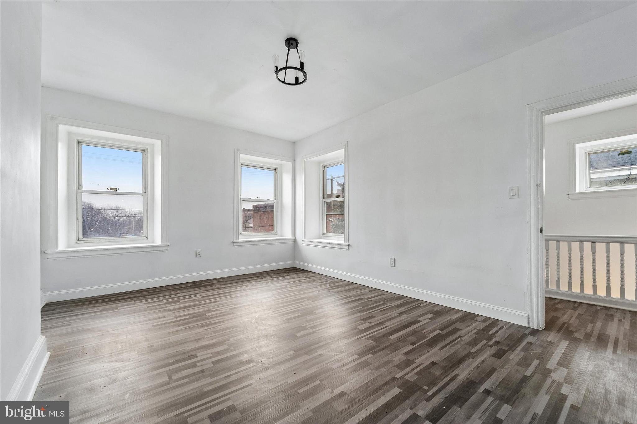 79 High Street, Unit 2 Philadelphia, PA 19144 - Photo 7 of 17 a view of an empty room with wooden floor and a window