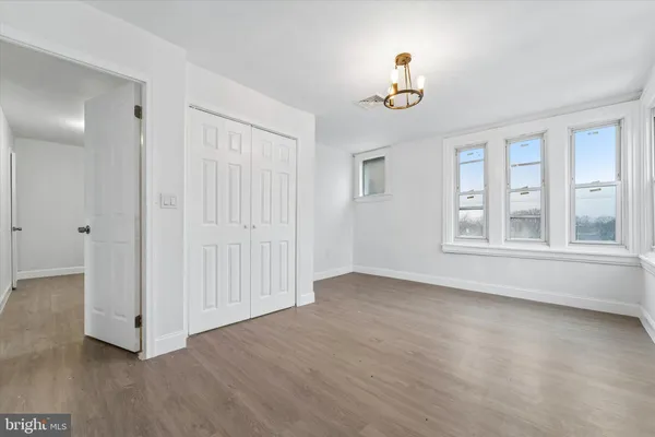 a view of an entryway with wooden floor