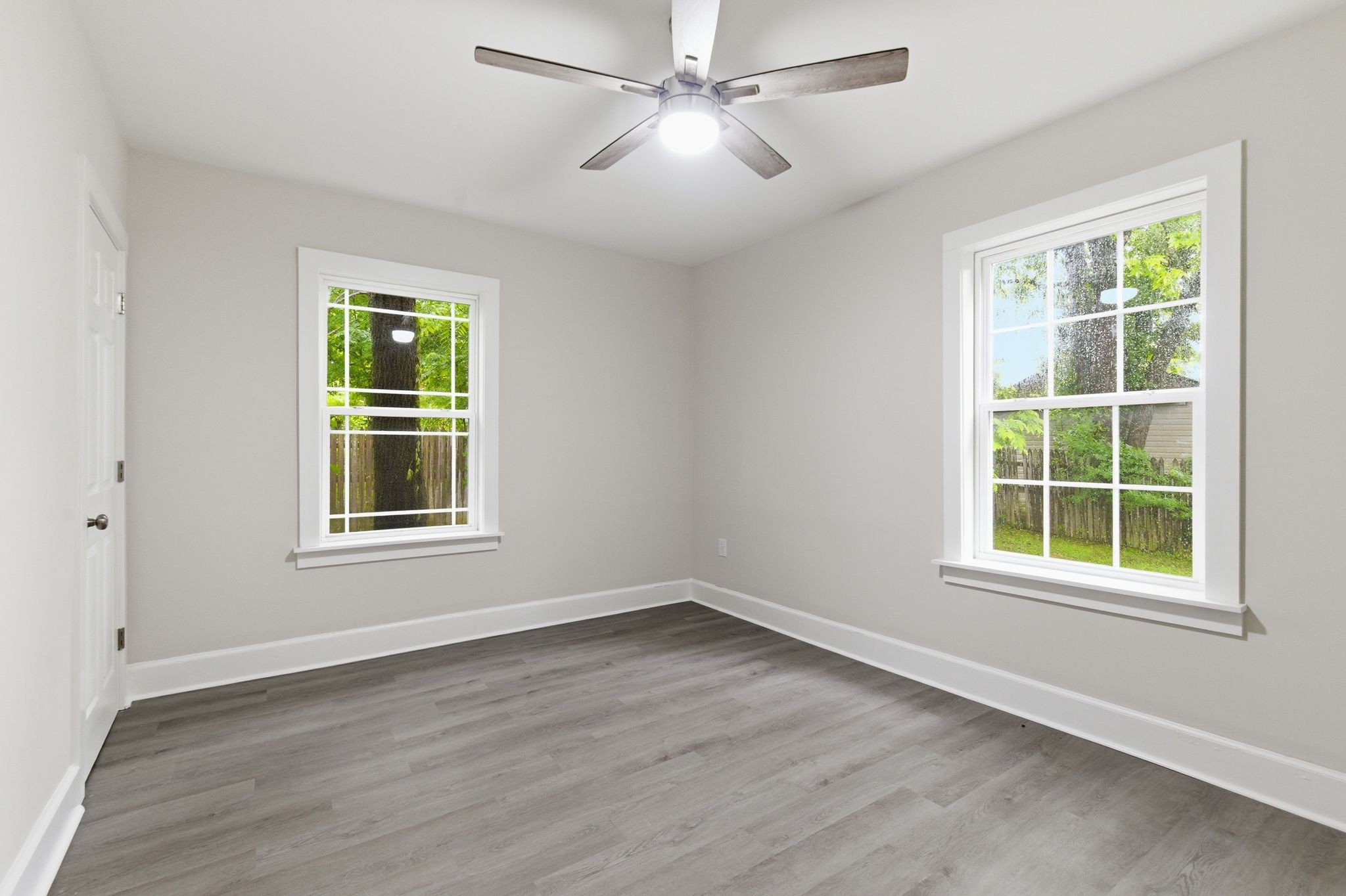 305 South Irwin Street Manchester, TN 37355 - Photo 25 of 40 a view of an empty room with a window and wooden floor