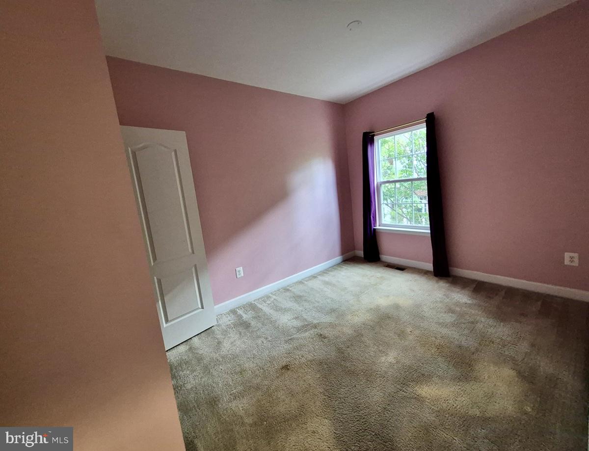 2126 Little Sorrel Way Silver Spring, MD 20902 - Photo 9 of 15 Bright and inviting pink-hued room.