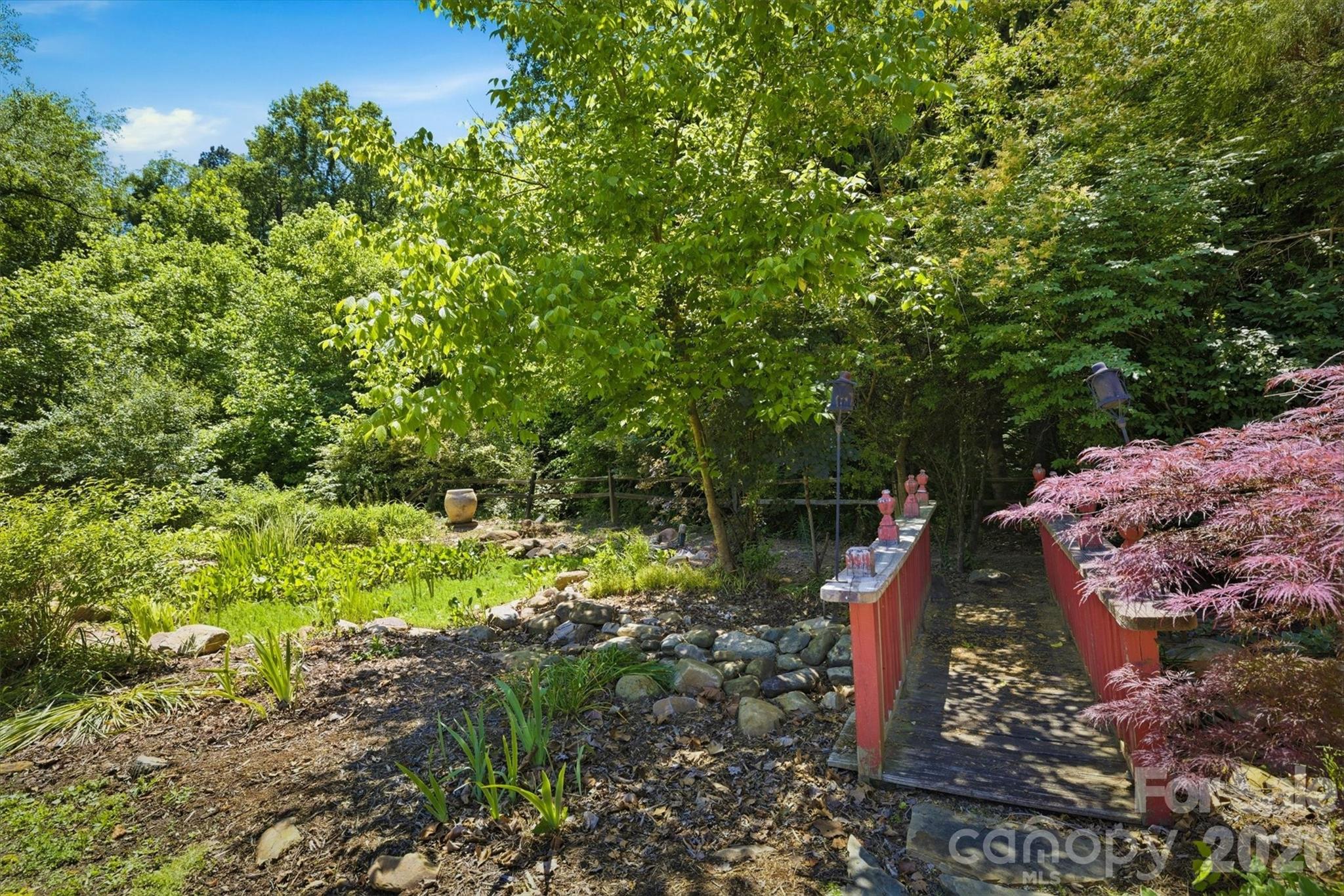 905 Carbon City Road Morganton, NC 28655 - Photo 6 of 29 a backyard of a house with lots of green space
