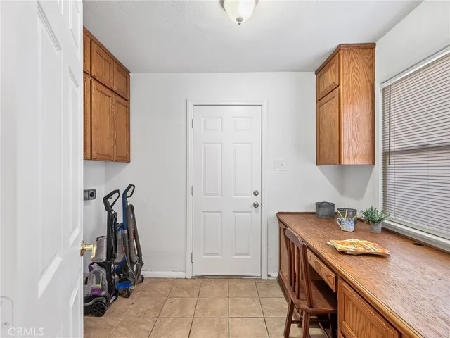 a kitchen with a sink cabinets and a window