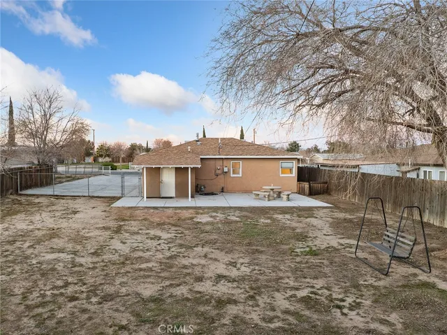 a view of a house with a snow in the yard