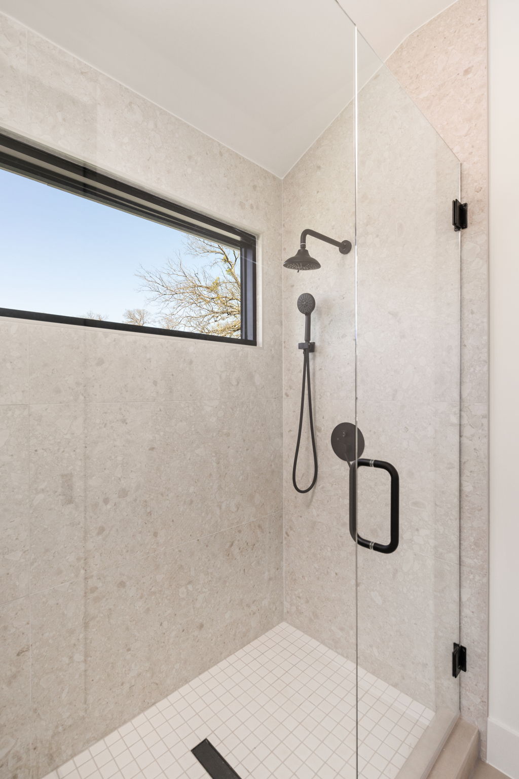 1610 Harvey Street, Unit 1 Austin, TX 78702 - Photo 25 of 39 Bathroom with a shower stall and vaulted ceiling