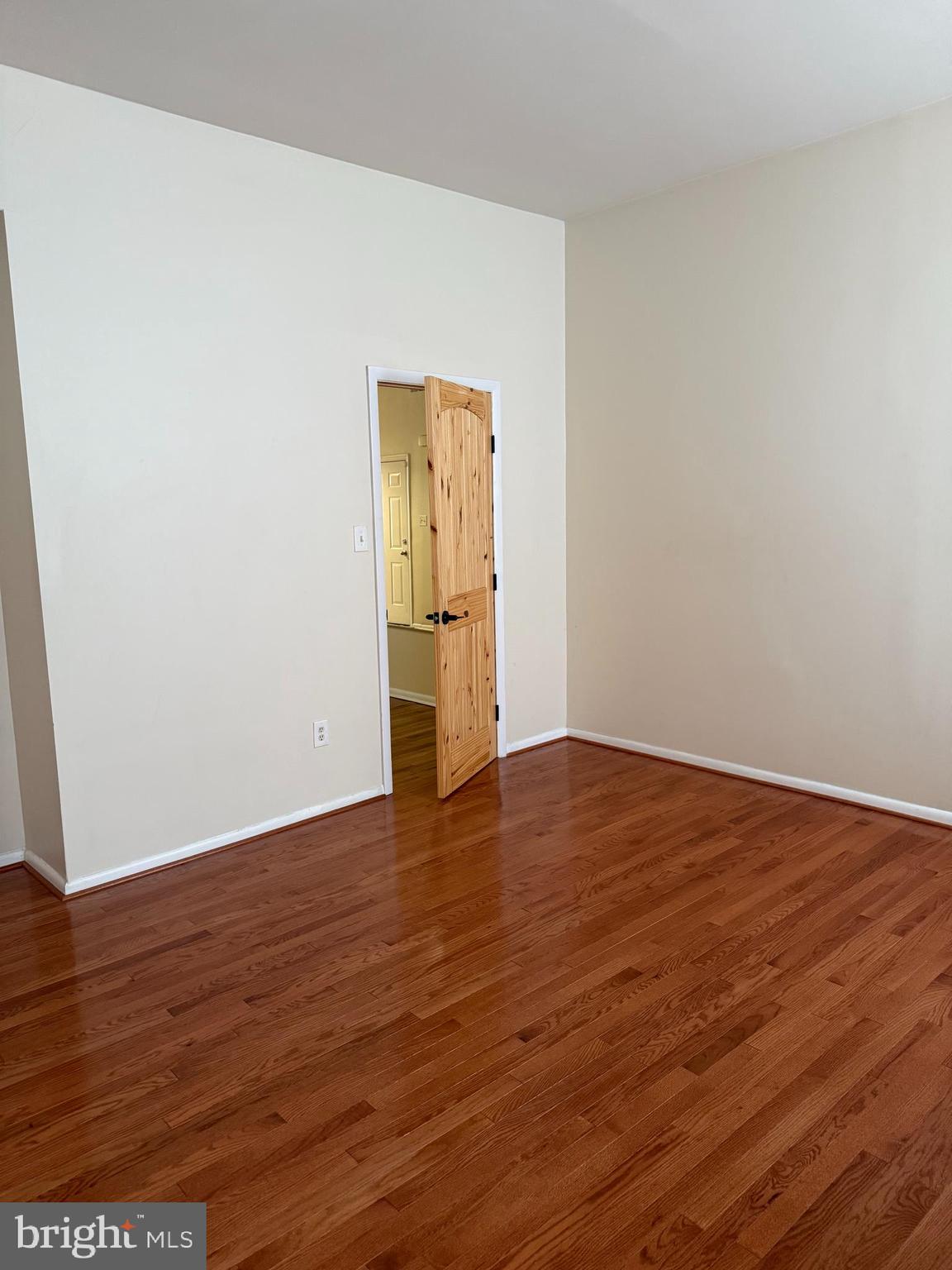 2005 Madison Avenue, Unit 2 Baltimore, MD 21217 - Photo 15 of 16 a view of an empty room with wooden floor