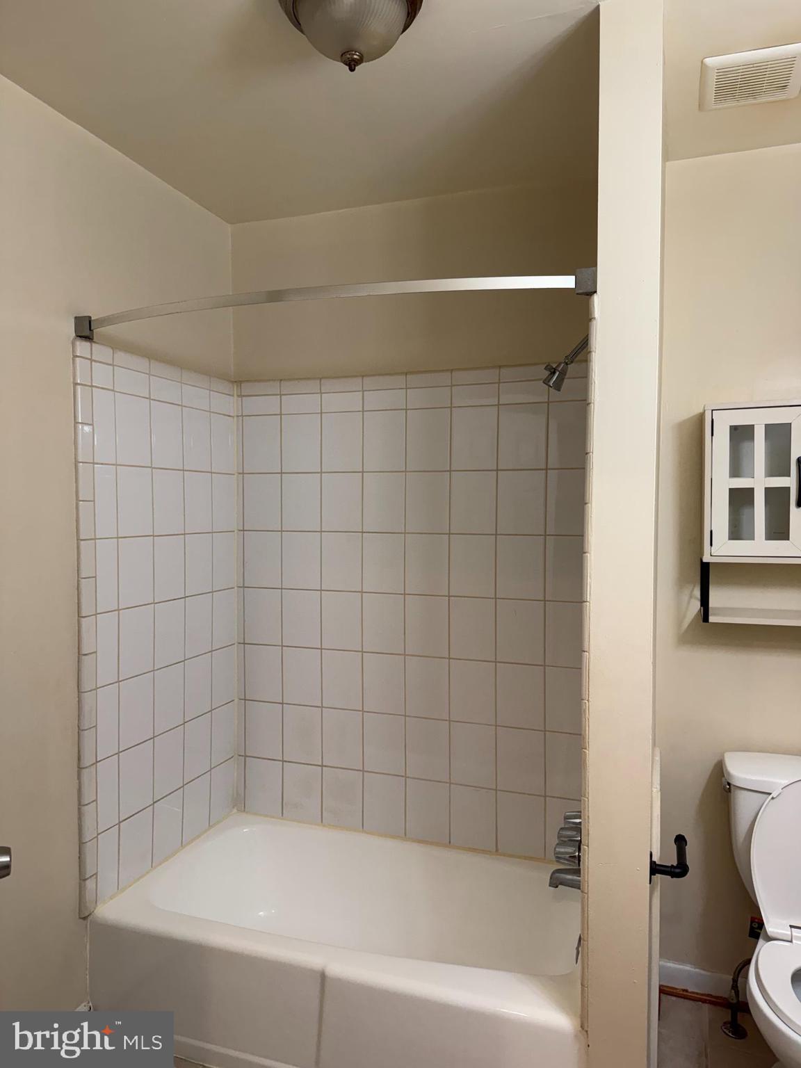 2005 Madison Avenue, Unit 2 Baltimore, MD 21217 - Photo 7 of 16 a bathroom with a bathtub and a toilet