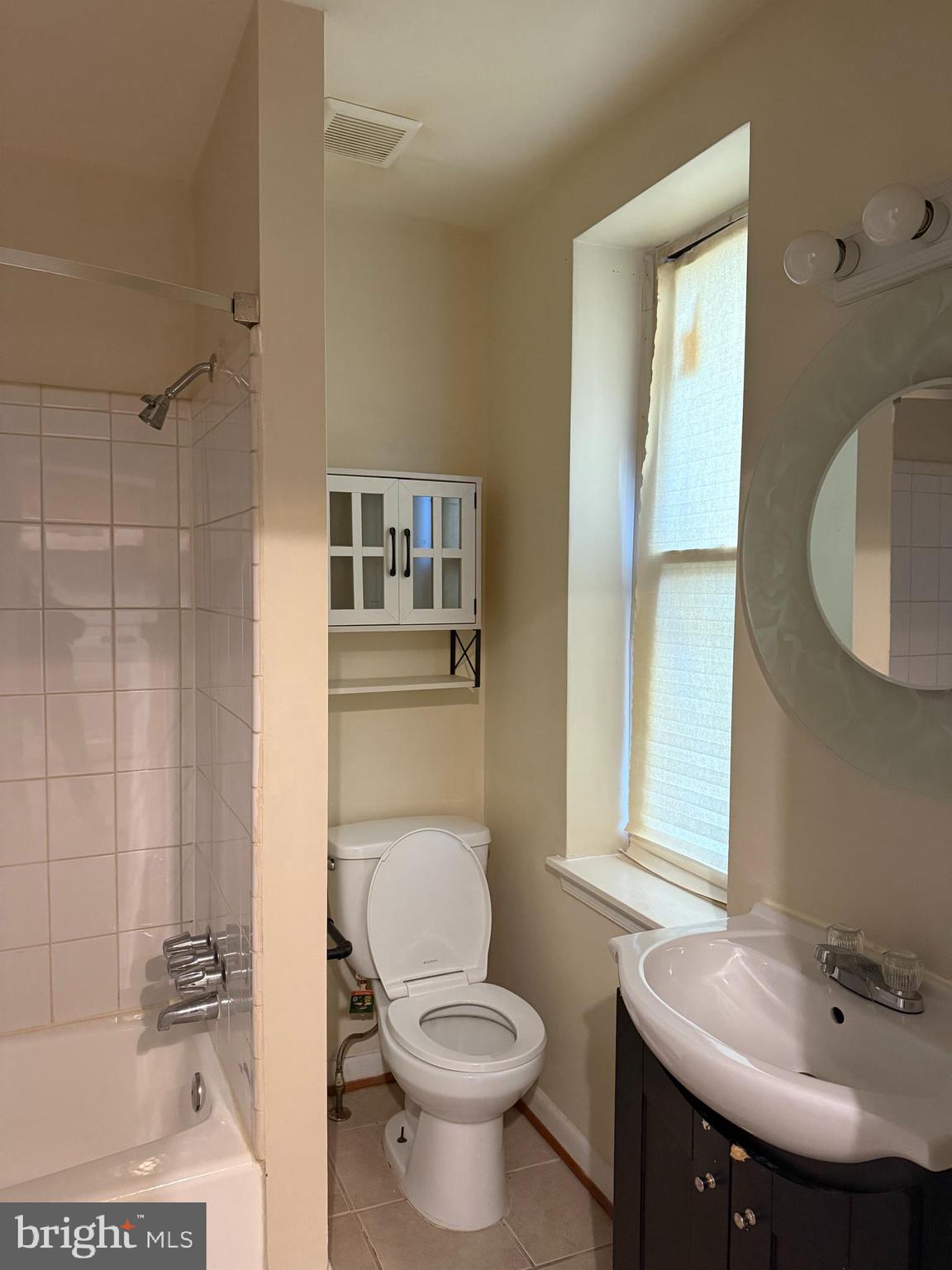 2005 Madison Avenue, Unit 2 Baltimore, MD 21217 - Photo 8 of 16 a bathroom with a sink toilet and shower