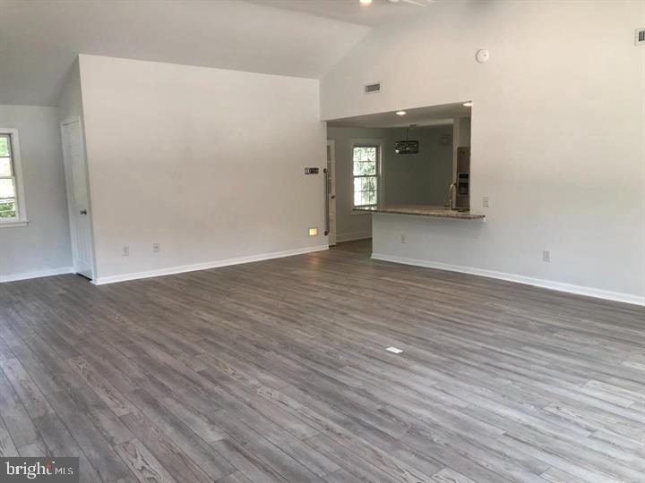 75 South Main Street Yardley, PA 19067 - Photo 12 of 29 an empty room with wooden floor and windows