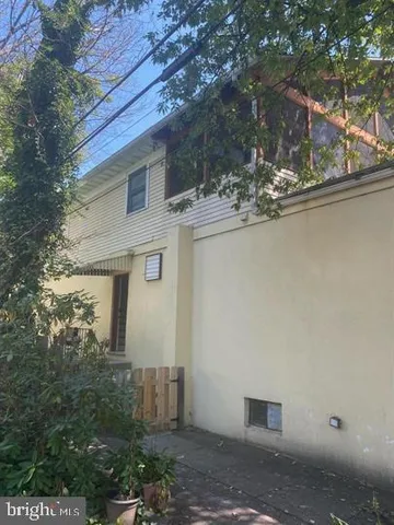 a view of a house with a tree