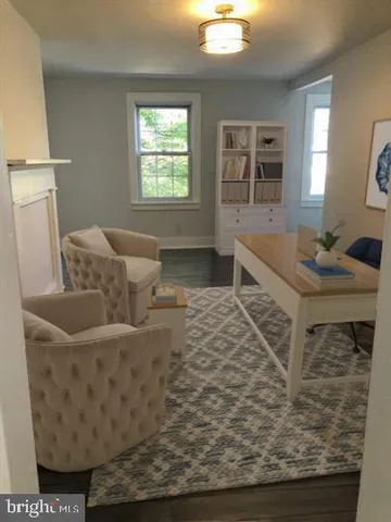 a living room with furniture and a rug