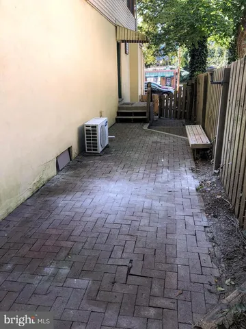 a view of a backyard with sitting area