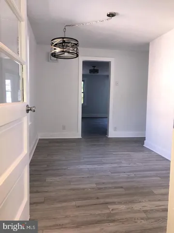 a view of a kitchen from the hallway
