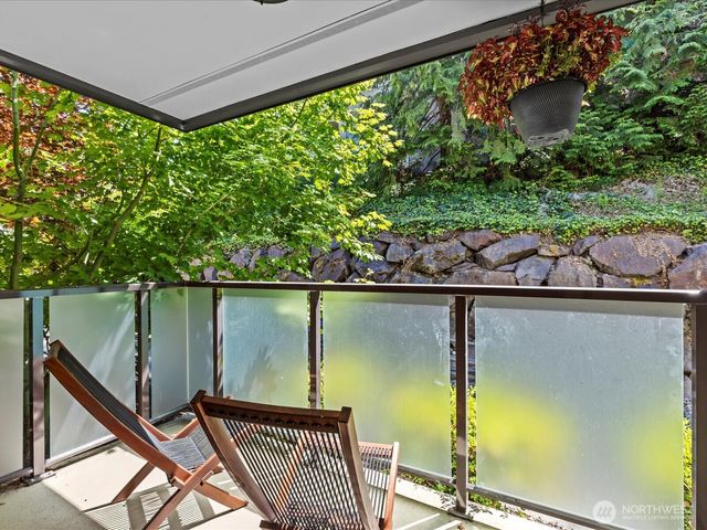 a view of balcony with wooden floor