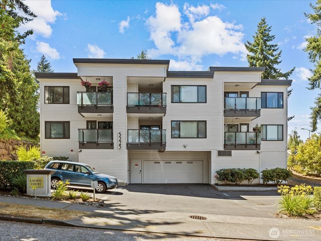 a car parked in front of a white building