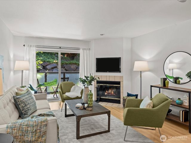 a living room with furniture fireplace and a flat screen tv